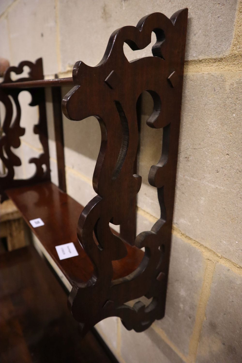 A Victorian mahogany two tier wall bracket, width 52cm depth 17cm height 46cm